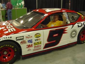 John Violi sitting in NASCAR Display Car